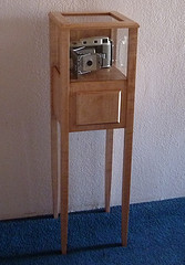 tall and thin display cabinet 
in maple with drawer