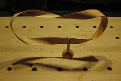 Mobius strip in wood on a base