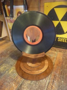 Support stand for the singular Aretino phonograph record, yes the center hole is 3 inches in diameter