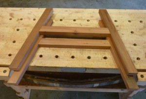 The two sides of the base of the rocker looking like a pairof bow saws.