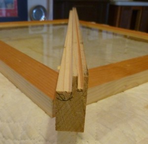 The groove on the right will hold the glass; the rabbet on the left will seat the trap door on the back of the frame.