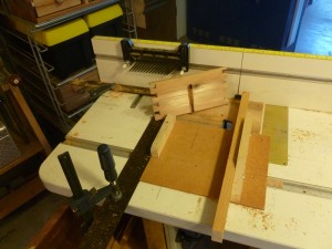 Sliding dingus holds the Prize Case sides and the stop on the left of the router table provides the ... well, the stop.