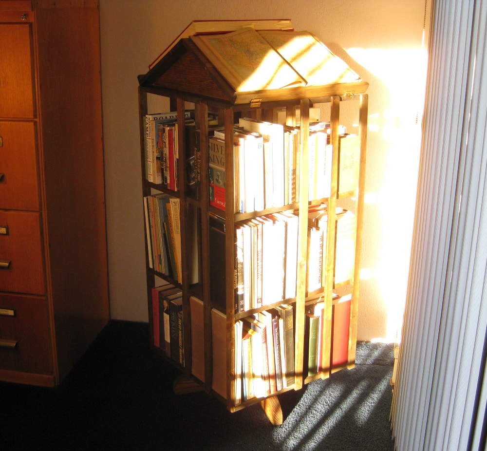 This revolving bookstand holds 12 linear feet of books, not counting the angled reading top